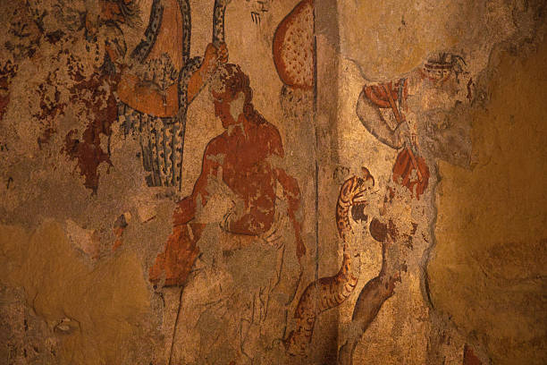 Ancient wall painting inside an Etruscan tomb in Tarquinia, Italy. This archaeological fresco, dating back to the Etruscan civilization of the 7th–3rd century BC, is part of the UNESCO World Heritage necropolis, offering a unique testimony of early Italic funerary art.