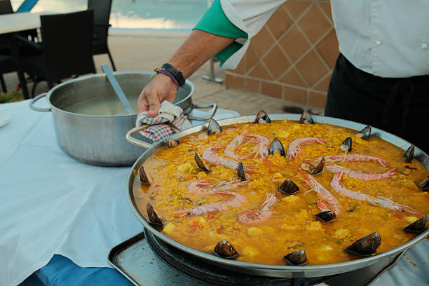Close-up of a traditional Valencian paella with various ingredients.