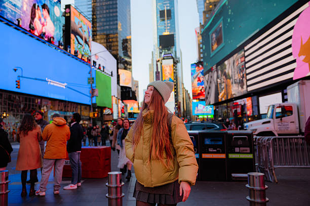 istock Happy Attractive Woman Exploring Times Square in NYC 2238980590