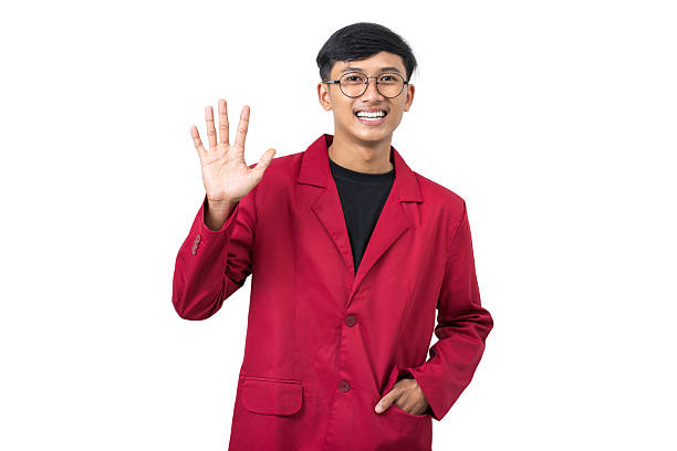 Smiling young college student waving Hand Hai hello gesture isolated on white background