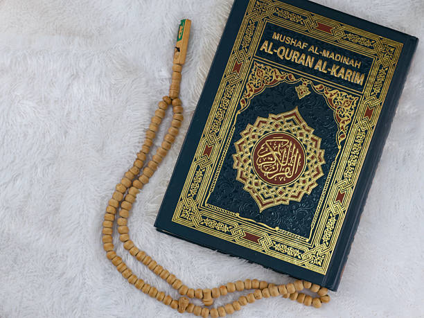 istock Holy Quran with arabic calligraphy 2238982864