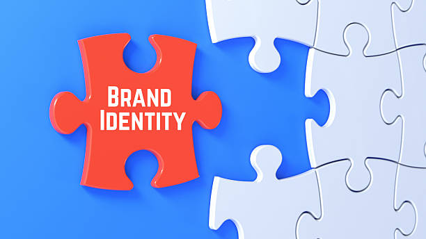 istock Red Puzzle Piece with Brand Identity Text Completing White Jigsaw on Blue Background 2238984687