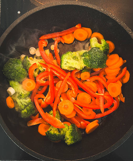 istock Asian fried noodles with chicken and vegetables in pan 2238985657