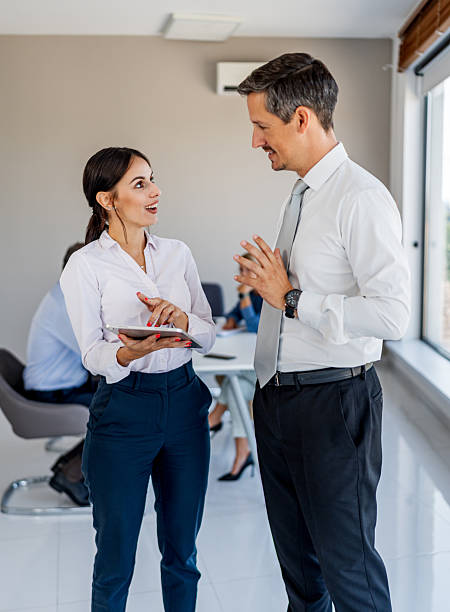 istock Business people discussing ideas in modern office 2238986609