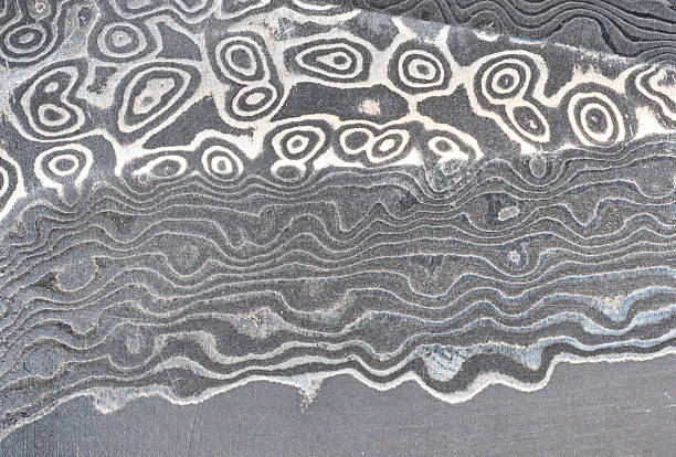istock Damascus steel knife texture, full frame 2238986904