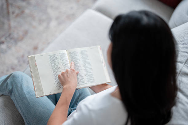 istock Woman Reading a Book on a Couch in a Calm Home Setting, Embracing Learning and Quiet Focus 2238987804