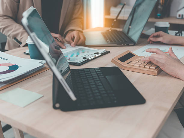 istock Financial statement analysis team, finance work with smartphones, laptops and tablets with digital marketing media in the form of virtual icons, financial manager meeting. 2238989015