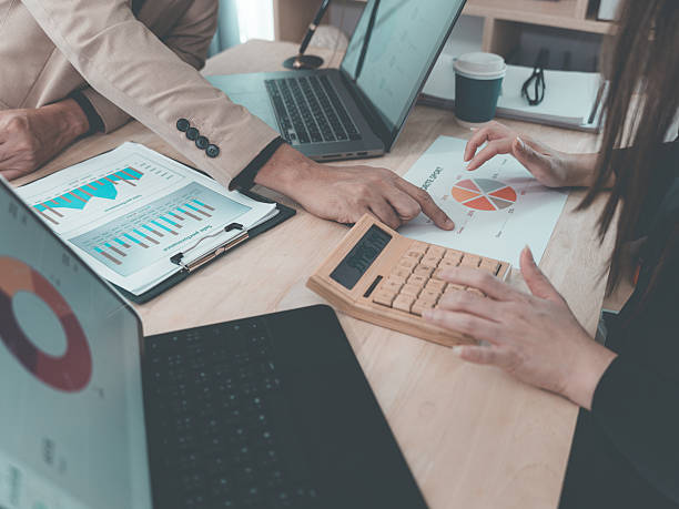istock Financial statement analysis team, finance work with smartphones, laptops and tablets with digital marketing media in the form of virtual icons, financial manager meeting. 2238989018