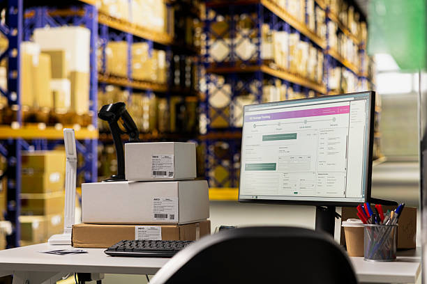istock Empty distribution hub with big industrial storage racks filled with packages 2238989040