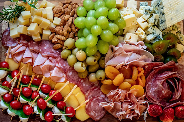 istock healthy food texture background, cheeses, nuts, grapes and cold cuts 2238989987