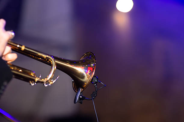 istock Musician Plays Trumpet During Live Performance at Night Event 2238990170