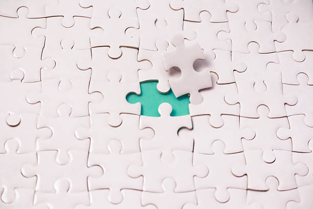 istock Complete the puzzle: The final piece for success in white jigsaw background 2238991544