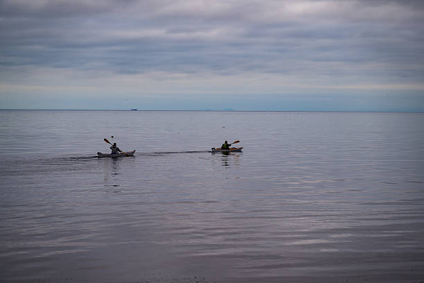 Kayakers set out on Puget Sound from Port Angeles on a summer morning.