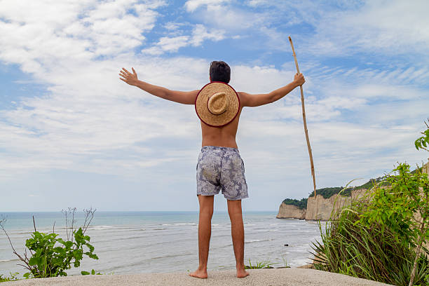 Shot of a man climbing a mountain on a sunny day