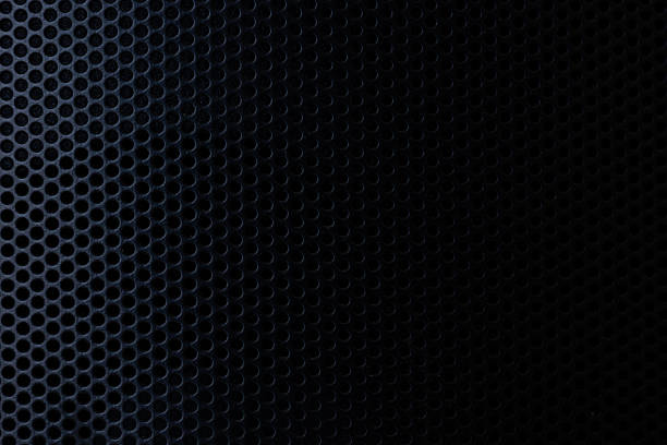 istock Black macro speaker surface,Safety net on the music speaker. Protective grid audio speakers. Close view of Black safety net. Metal perforated mesh, abstract pattern, Abstract black background. Professional audio equipment. 2238997908