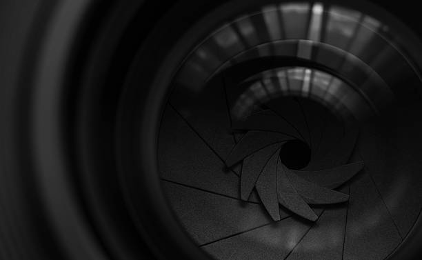 Close-up camera lens,Photo Camera or Video lens close-up on black background, objective, concept of photographer camera man job, looking for a photographer,