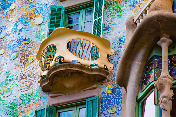 Detailed close-up of a single handcrafted iron balcony featuring intricate baroque patterns and vibrant Talavera ceramic tiles. Captured in natural light, highlighting the elegance and craftsmanship of traditional Mexican colonial architecture, perfect for travel, cultural, and architecture-focused projects.