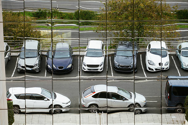 istock Parking lot reflected in an office building facade 2238999001