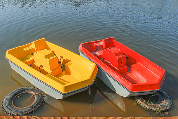 Pedalo boats that are moored at a dock. Copy space for text.