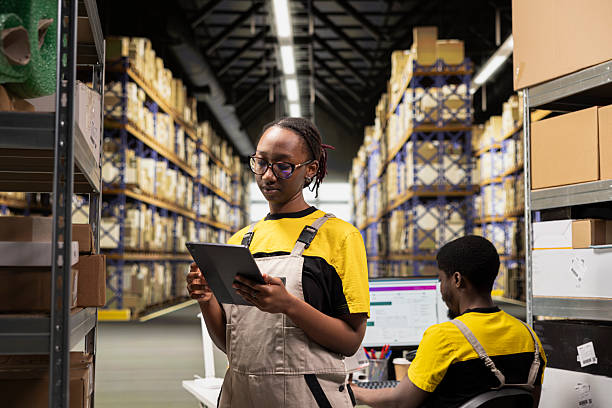 istock Warehouse operations staff reviewing package dispatch details 2239001753