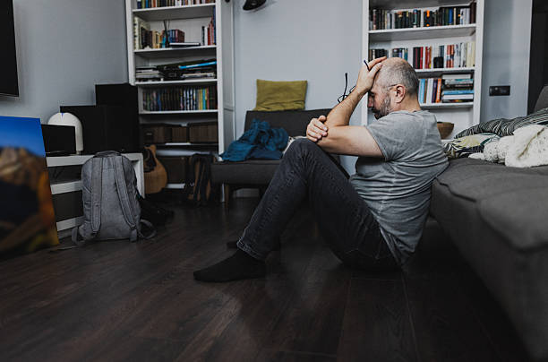 istock Thoughtful Elderly Man Sitting at Home in Deep Contemplation. Life Problems Concept 2239004248