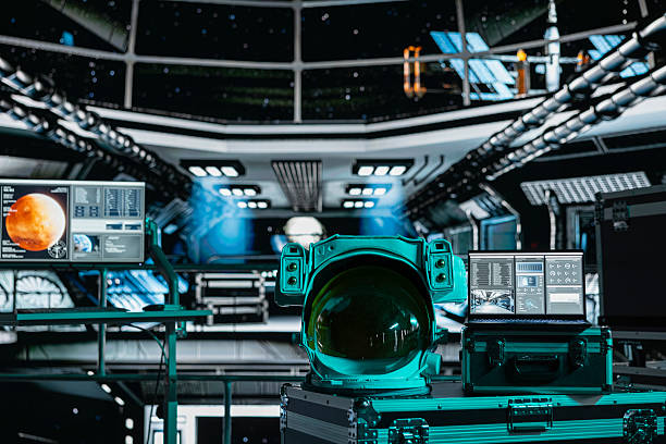 istock Close up of space helmet next to laptop in spaceship displaying Mars scan data 2239007228
