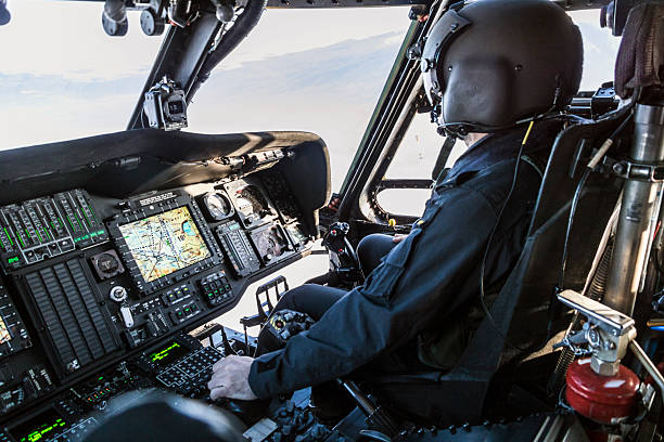 istock Army pilot flying military helicopter 2239008484