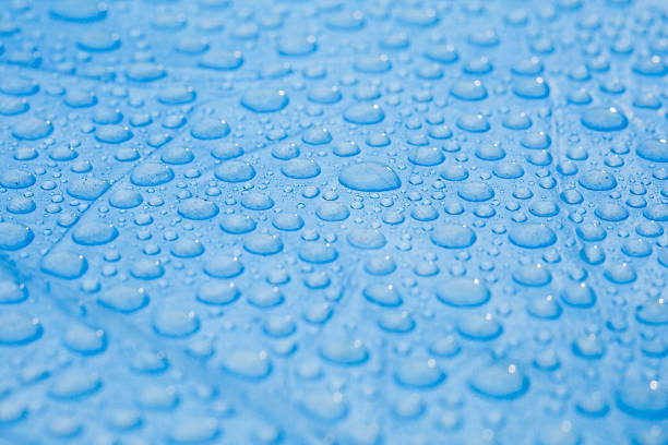 istock Water Droplets on Blue Surface, Rain Consept , Writing Area with Raindrops 2239011114