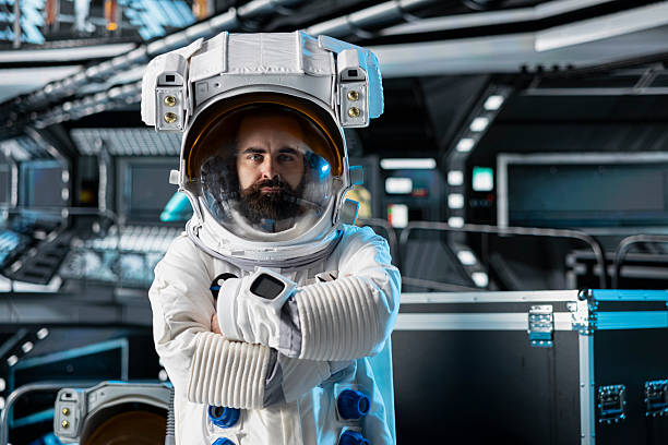 Portrait of astronaut testing helmet systems during routine equipment check inside orbital station. Spaceship crew member running diagnostics to confirm suit integrity and mission readiness
