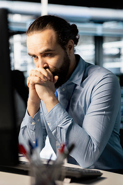 istock Technician in server room worried after reading troublesome diagnostic report 2239013741