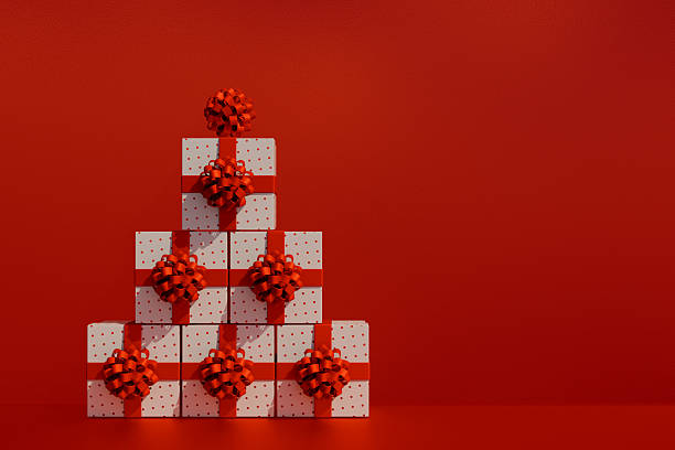 istock Stacked white gift boxes with red ribbons on red background for christmas. 3d rendering 2239017689