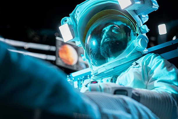 Cosmonaut losing hope, fainting after space station catastrophe during journey to Mars. Blue lights flashing over man despairing after spaceship getting damaged during red planet voyage