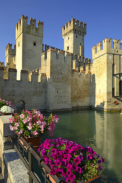 Sirmione, Italy - June 4, 2015: Lagoon in the Scaliger Castle. The famous castle of Sirmione and its small port are an uncommon example of a fortress used as a port. The building of this complex started in 1277 by Mastino della Scala.