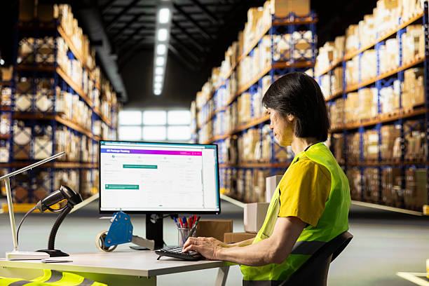 istock Asian warehouse employee overseeing cargo parcels tracking on the computer software 2239026216