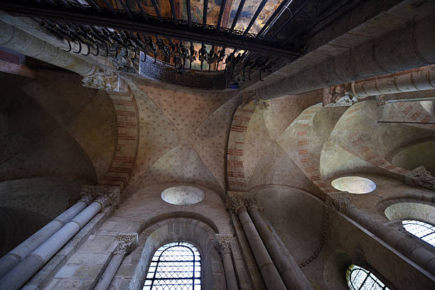 The Basilica of Saint-Sernin is a church in Toulouse. The image shows the interior of the basilica (measures 115 x 64 x 21 meters). The central nave is barrel vaulted; the four aisles have rib vaults and are supported by buttresses.