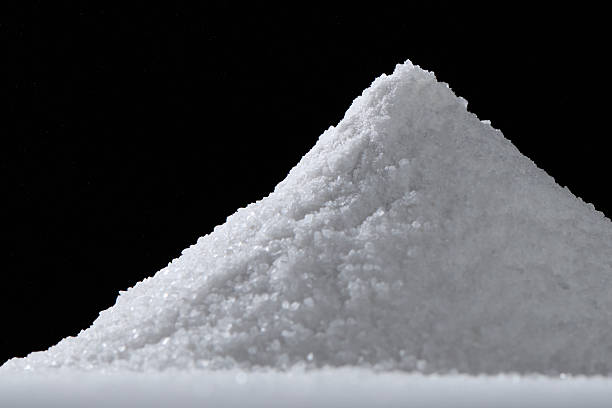 istock Powdery white substance forming conical pile against dark backdrop, suggesting chemical, culinary, or potentially illicit context 2239035367