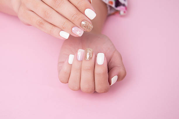 istock Female hands with romantic manicure nails, white gel polish 2239035581