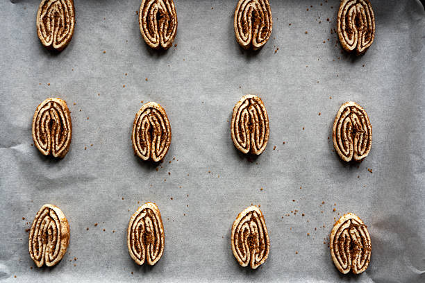 The process of making cinnamon palmiers.