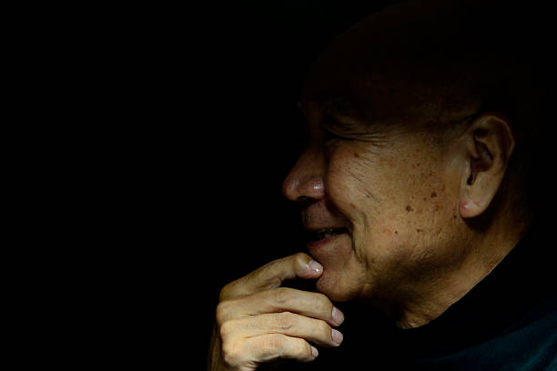 Close-up of a smiling old man's face