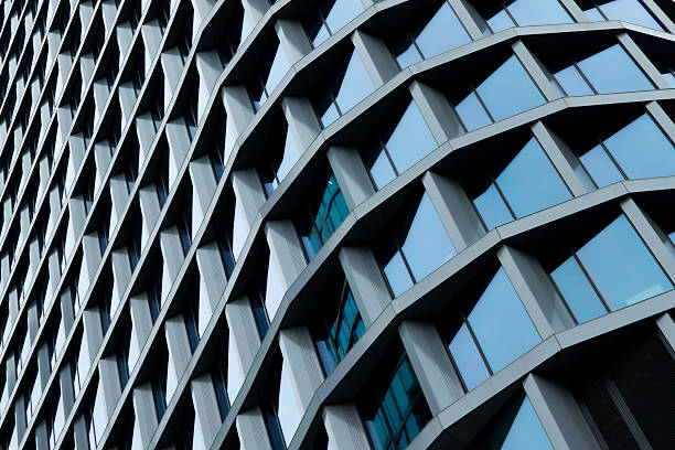 istock Sleek modern glass facade with repeating geometric balconies creating an abstract architectural pattern 2239038725