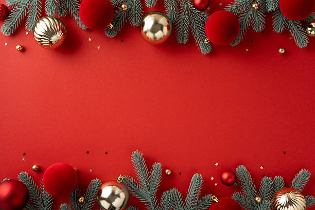 istock Bright holiday scene features a red backdrop framed by pine branches and shiny ornaments, perfect for Christmas and New Year promotions, greetings, and festive visuals 2239048243