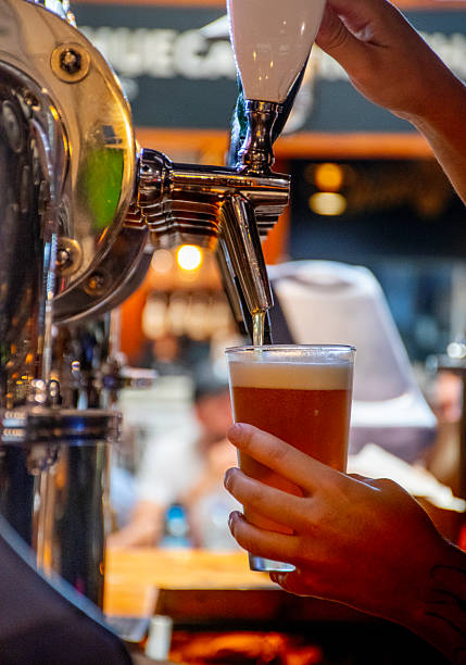 istock taking beer tap beer hand tap handle in bar 2239048531