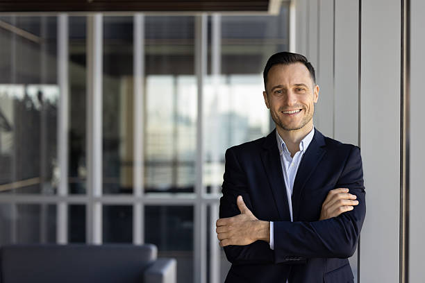 istock Happy young Hispanic company owner man posing in office hall 2239049574