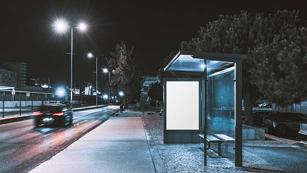 istock Blank bus stop mock-up at night 2239051362