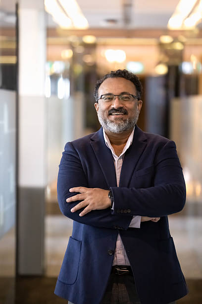 istock Cheerful senior Indian executive man posing for corporate portrait 2239051364