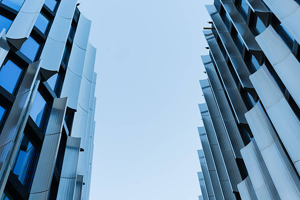 istock Modern Glass Facade Buildings Against Sky 2239059038