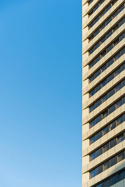 istock Modern High-Rise Building Against Blue Sky 2239060343