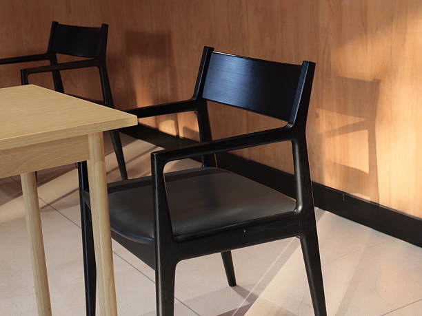 istock A Modern Black Chair Displayed in a Cozy Cafe Setting, Perfect for Relaxing and Enjoying Caffeine 2239067111