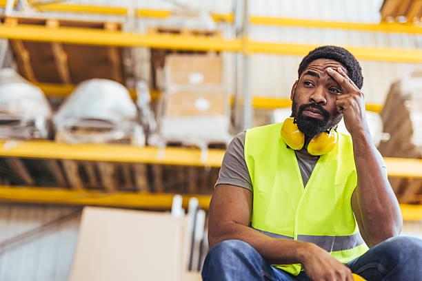 istock Worker Taking a Break in a Warehouse Wearing High-Visibility Vest 2239068204