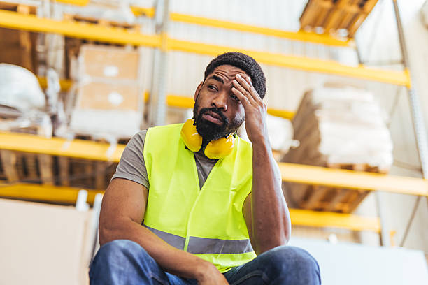 istock Warehouse Worker Expressing Fatigue During a Break in a Storage Facility 2239068224